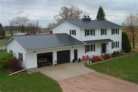 charcoal gray metal roof on white house|white house roofing colors.